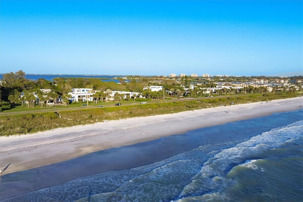 825 Bayport Way, Unit 825 Longboat Key, FL 34228 - Photo 10 of 62 a view of an ocean beach and mountain