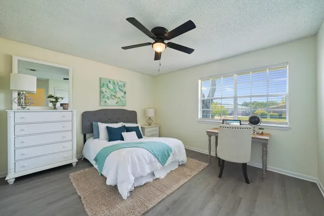 a bed room with a bed and a window