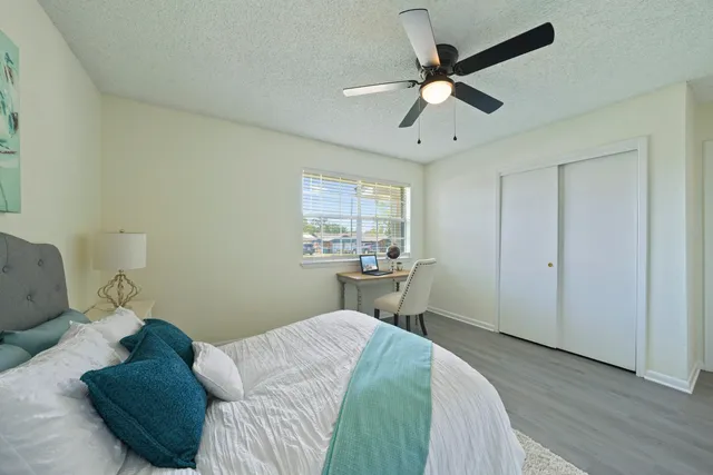 a bedroom with a bed furniture and a window
