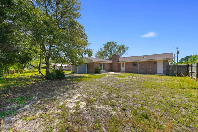 a front view of a house with a yard and a garage