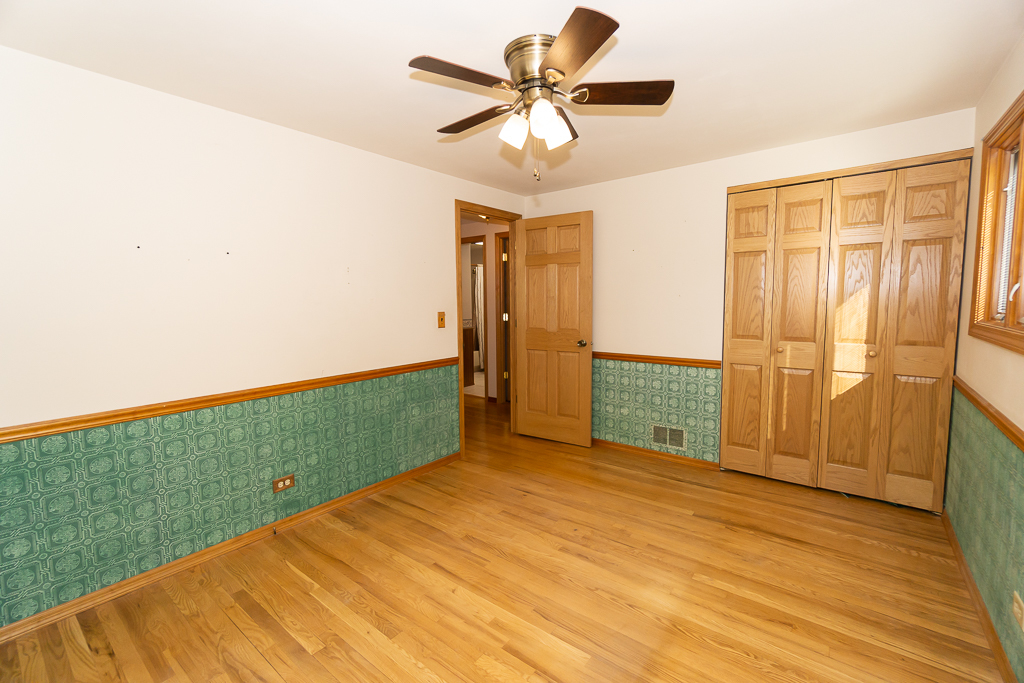 1908 Capri Lane Schaumburg, IL 60193 - Photo 21 of 39 wooden floor in an empty room with a window