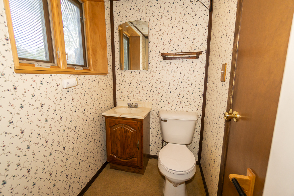 1908 Capri Lane Schaumburg, IL 60193 - Photo 33 of 39 a bathroom with a toilet and a sink