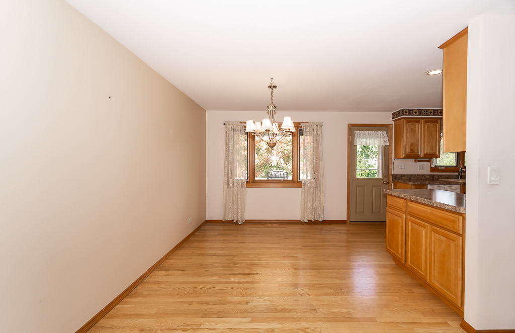 1908 Capri Lane Schaumburg, IL 60193 - Photo 7 of 39 a view of a kitchen with a sink and a window