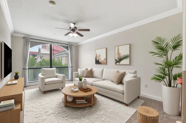 a living room with furniture a chandelier and a large window