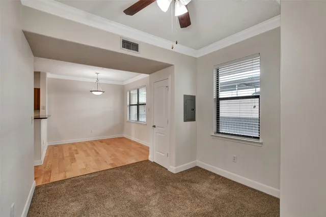 a view of livingroom with hardwood floor and ceiling fan