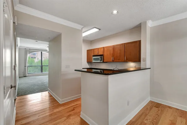 a view of a kitchen from the hallway