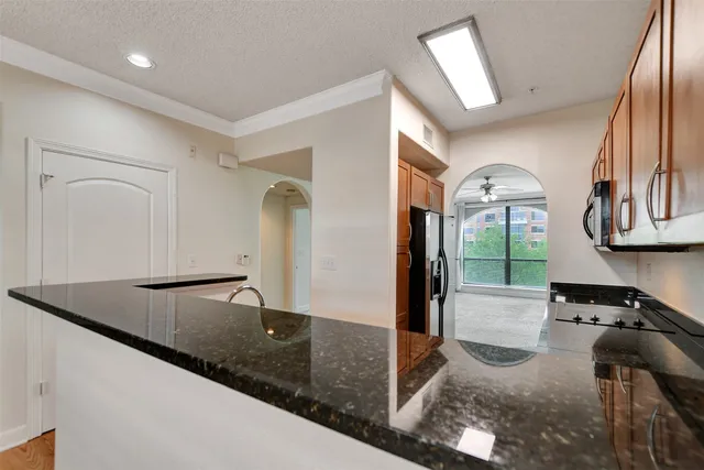 a kitchen with a refrigerator and a sink