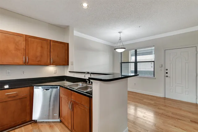 a view of a kitchen from the hallway