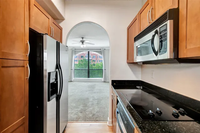 a view of empty room with ceiling fan