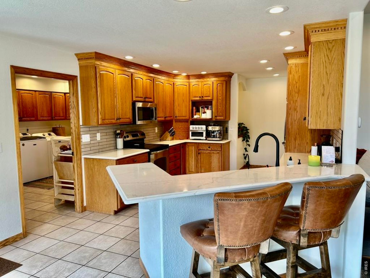 14348 Dakota Road Sterling, CO 80751 - Photo 17 of 50 Kitchen & Entry to Laundry Room