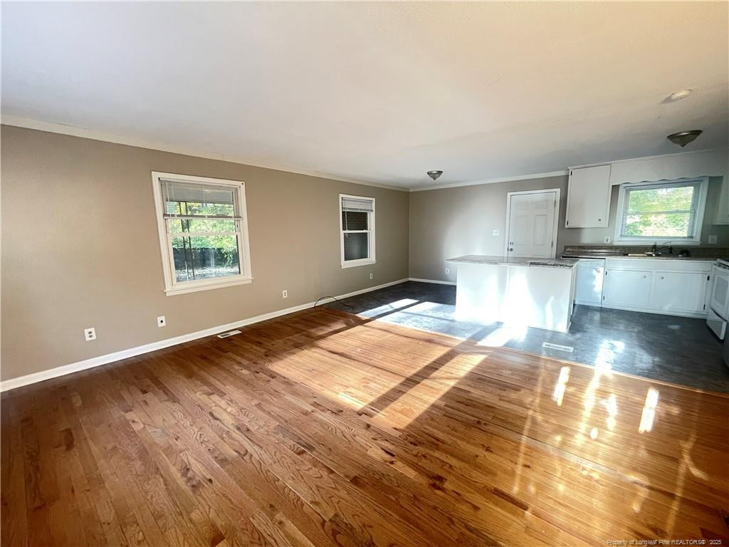 1025 North Hill Road Fayetteville, NC 28303 - Photo 4 of 14 a view of a kitchen with an empty room and window