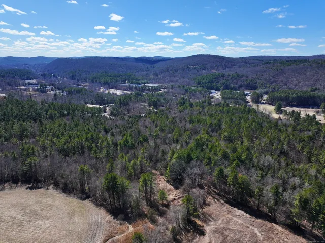 a view of a lake with mountains and mountain view in back