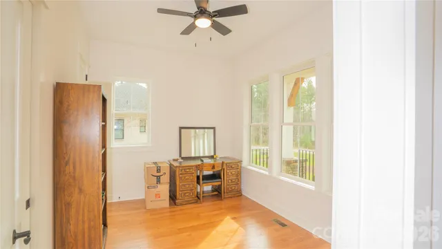 a view of a livingroom with furniture and a window