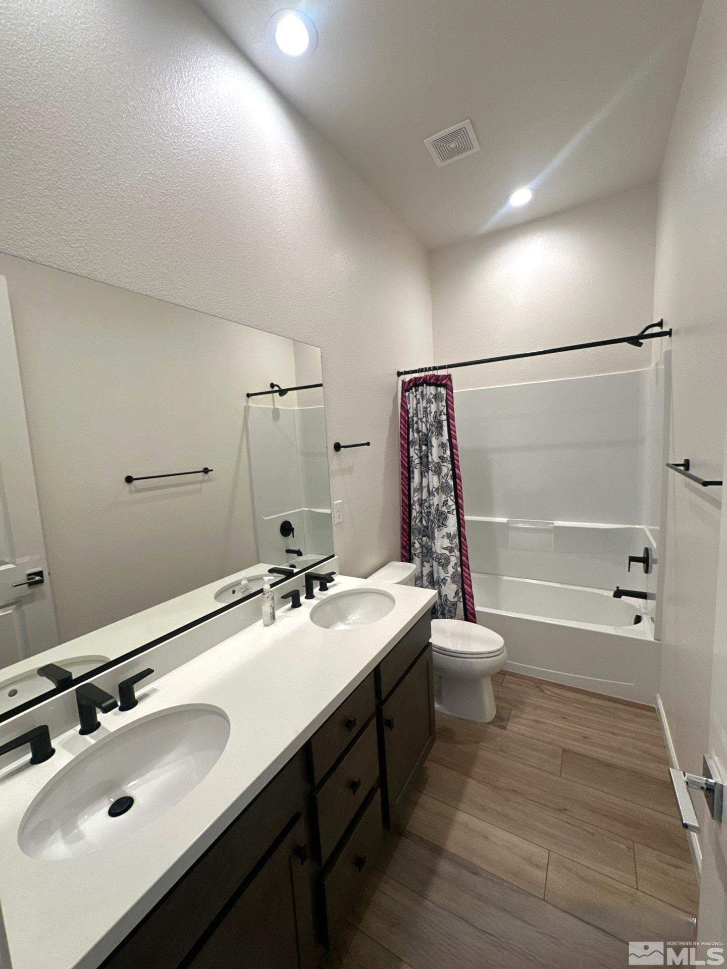2494 Metolius Drive Sparks, NV 89436 - Photo 17 of 22 a bathroom with a sink double vanity granite toilet tub and shower