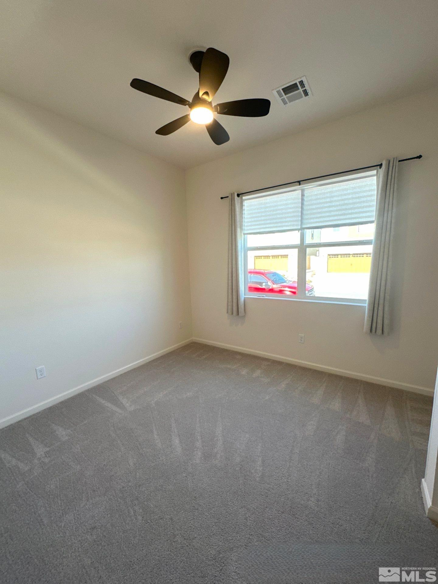 2494 Metolius Drive Sparks, NV 89436 - Photo 18 of 22 a view of an empty room with a window