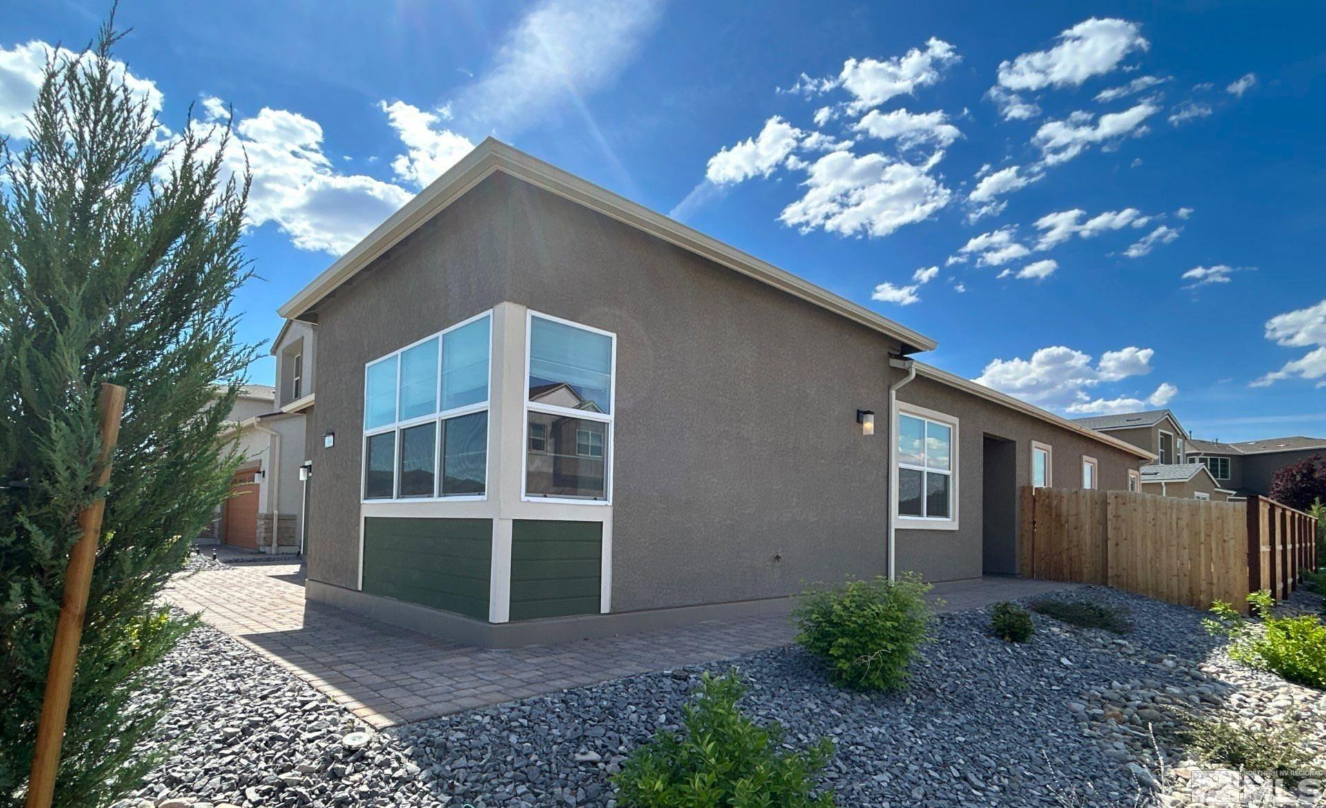 2494 Metolius Drive Sparks, NV 89436 - Photo 2 of 22 a house view with a garden space