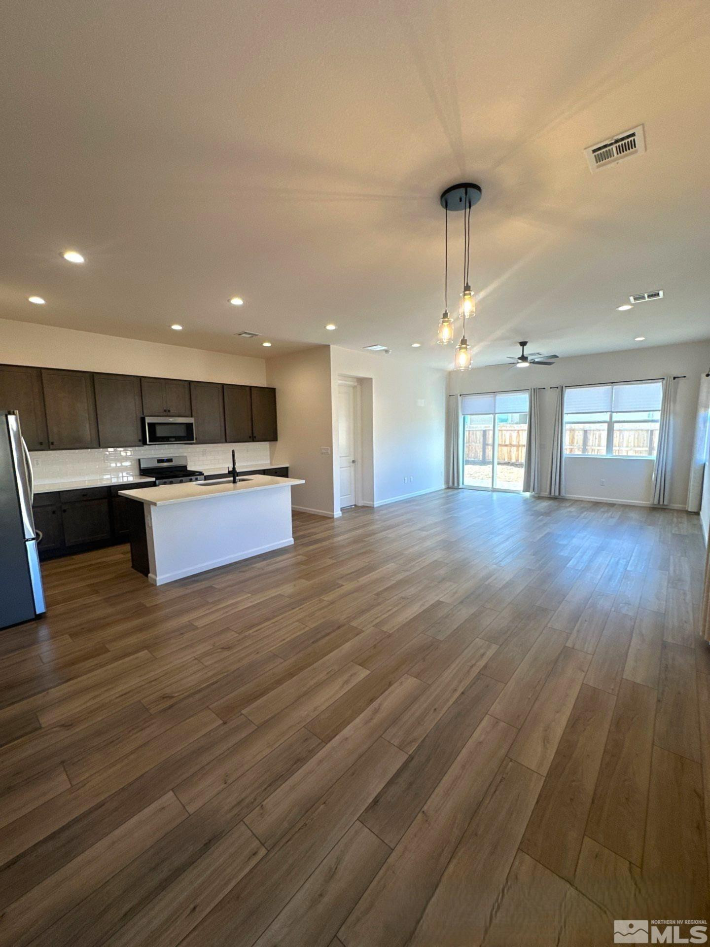 2494 Metolius Drive Sparks, NV 89436 - Photo 3 of 22 a view of kitchen and hall with wooden floor
