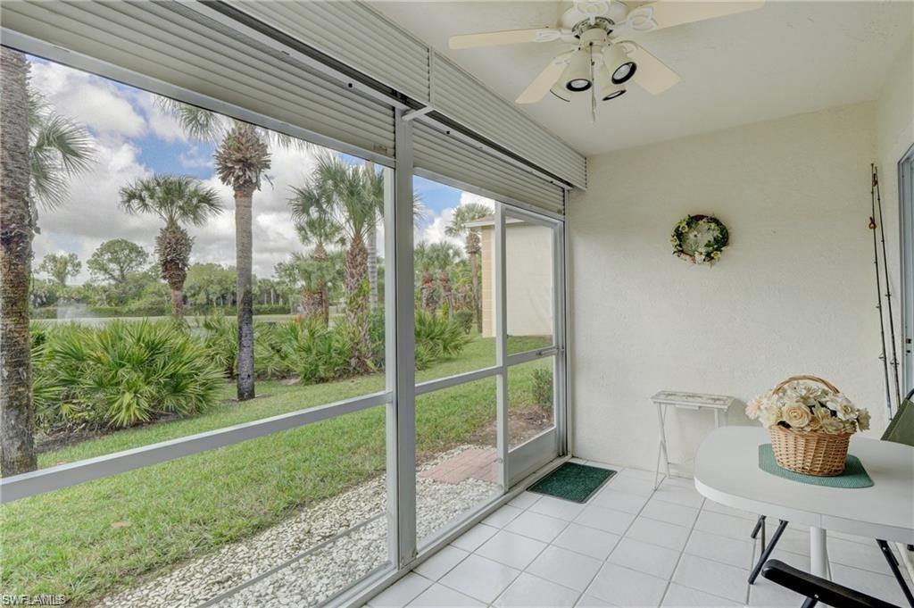153 Gabriel Circle, Unit 3003 Naples, FL 34104 - Photo 25 of 38 a view of a room that has a bed and wooden floor