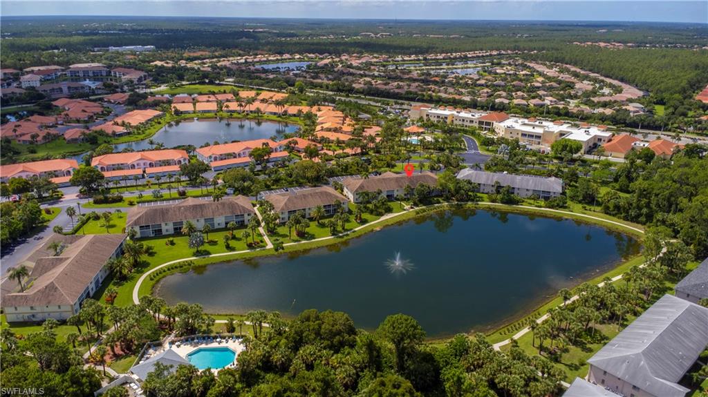 153 Gabriel Circle, Unit 3003 Naples, FL 34104 - Photo 27 of 38 an aerial view of residential houses with outdoor space and river