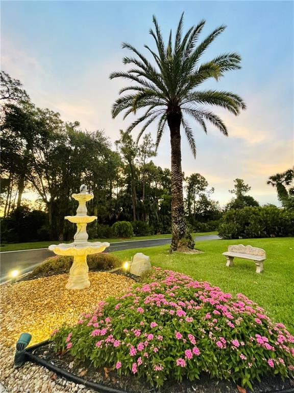 153 Gabriel Circle, Unit 3003 Naples, FL 34104 - Photo 33 of 38 a view of a park with large trees and plants