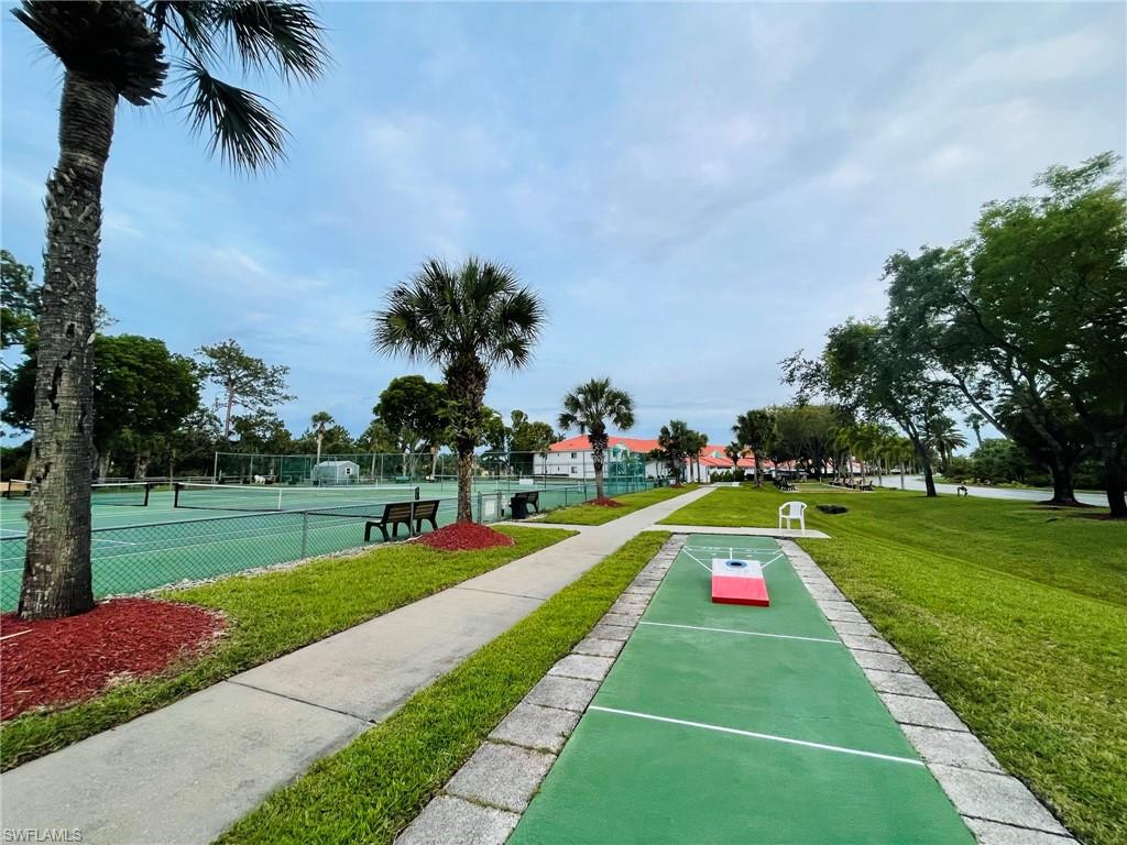 153 Gabriel Circle, Unit 3003 Naples, FL 34104 - Photo 37 of 38 a front view of a house with swimming pool and yard