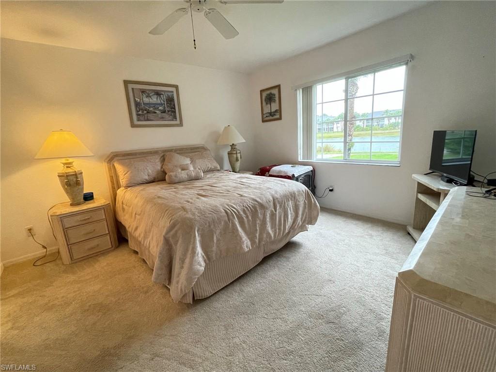 153 Gabriel Circle, Unit 3003 Naples, FL 34104 - Photo 8 of 38 a bedroom with bed and a window