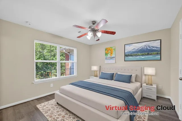 a bedroom with a large bed and a window