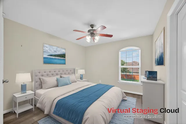 a bedroom with a bed and a window