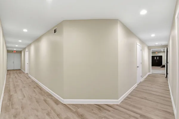 a view of a big room with wooden floor