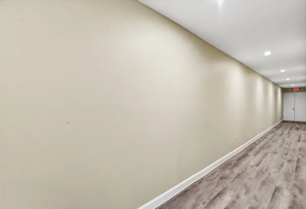 a lobby with furniture and a rug