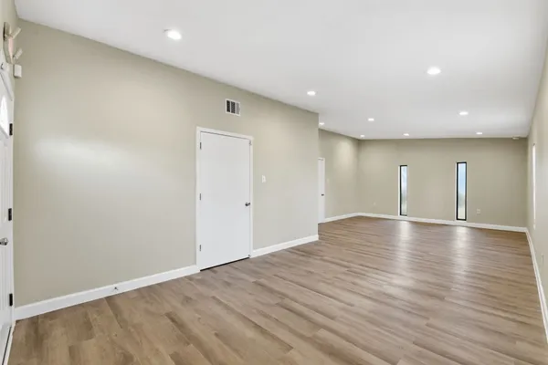 a view of a kitchen with wooden floor