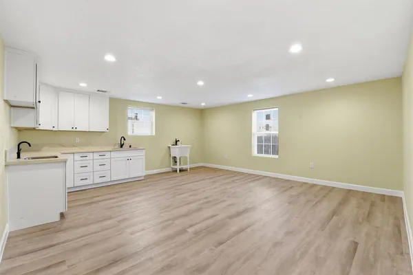 a view of kitchen with wooden floor