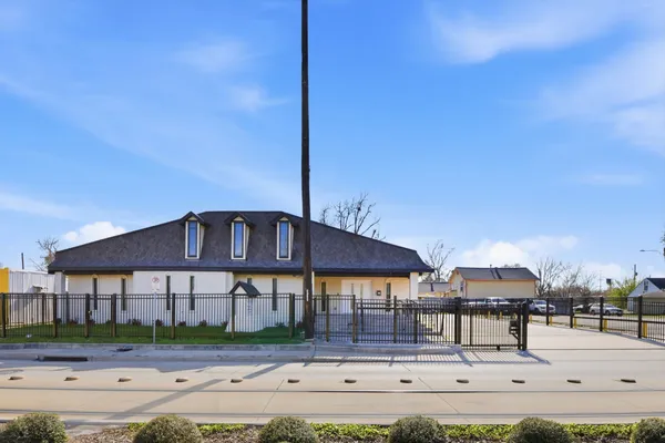 a front view of a house with garden