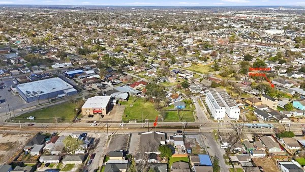 an aerial view of a residential houses with outdoor space