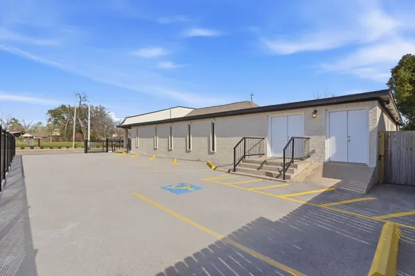 a view of a patio with table and chairs with wooden floor and fence