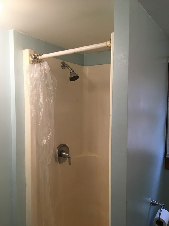 8 Pioneer Way Springfield, MA 01119 - Photo 4 of 9 a bathroom with a glass shower door