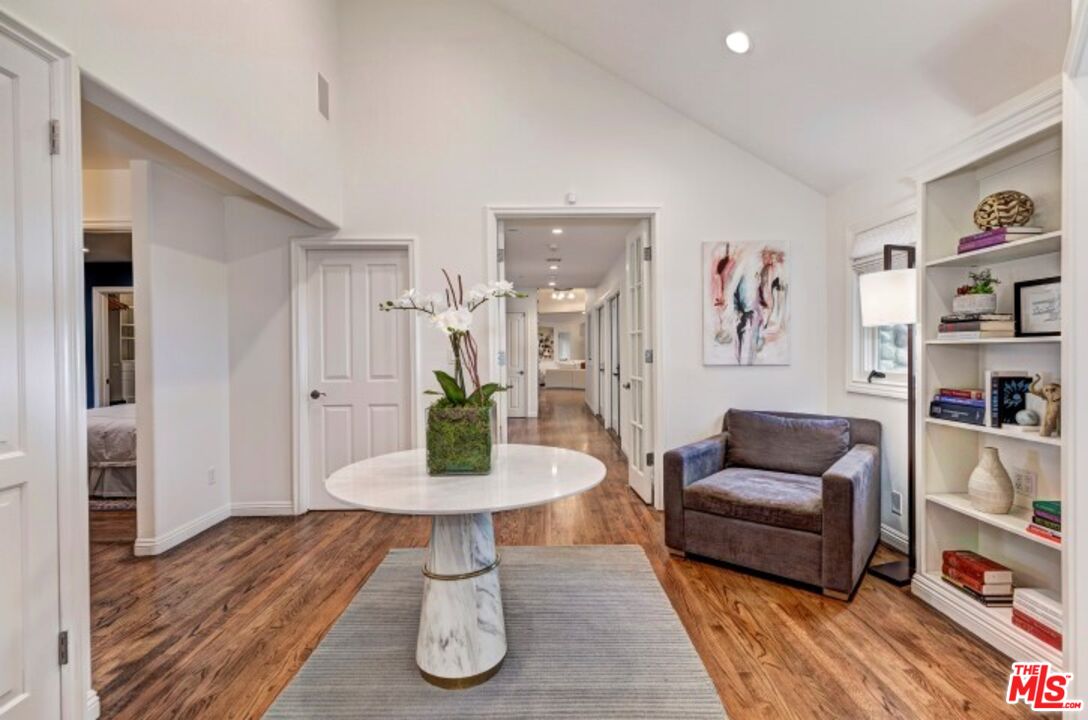 20779 Big Rock Drive Malibu, CA 90265 - Photo 14 of 37 a living room with furniture and a wooden floor