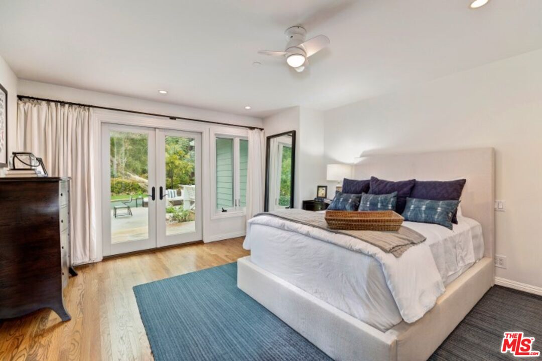 20779 Big Rock Drive Malibu, CA 90265 - Photo 24 of 37 a bedroom with bed and a large window