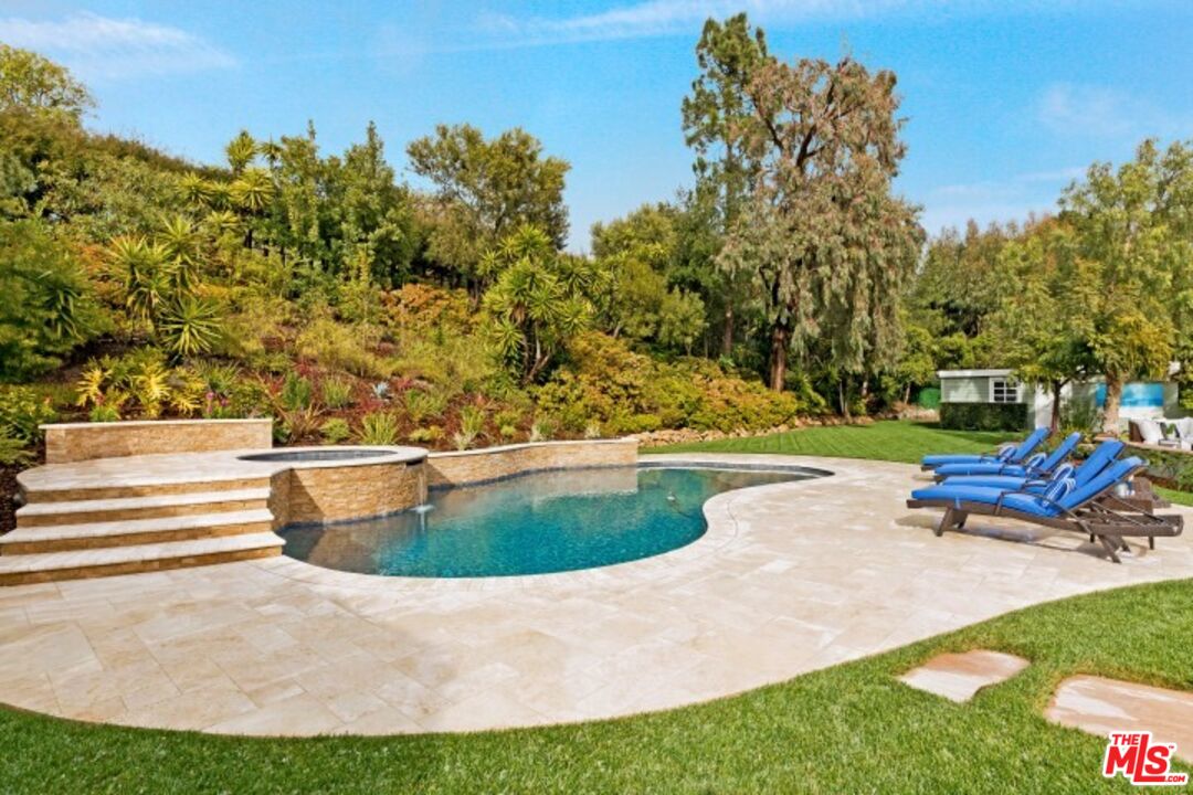 20779 Big Rock Drive Malibu, CA 90265 - Photo 30 of 37 a view of a swimming pool with a yard and sitting area