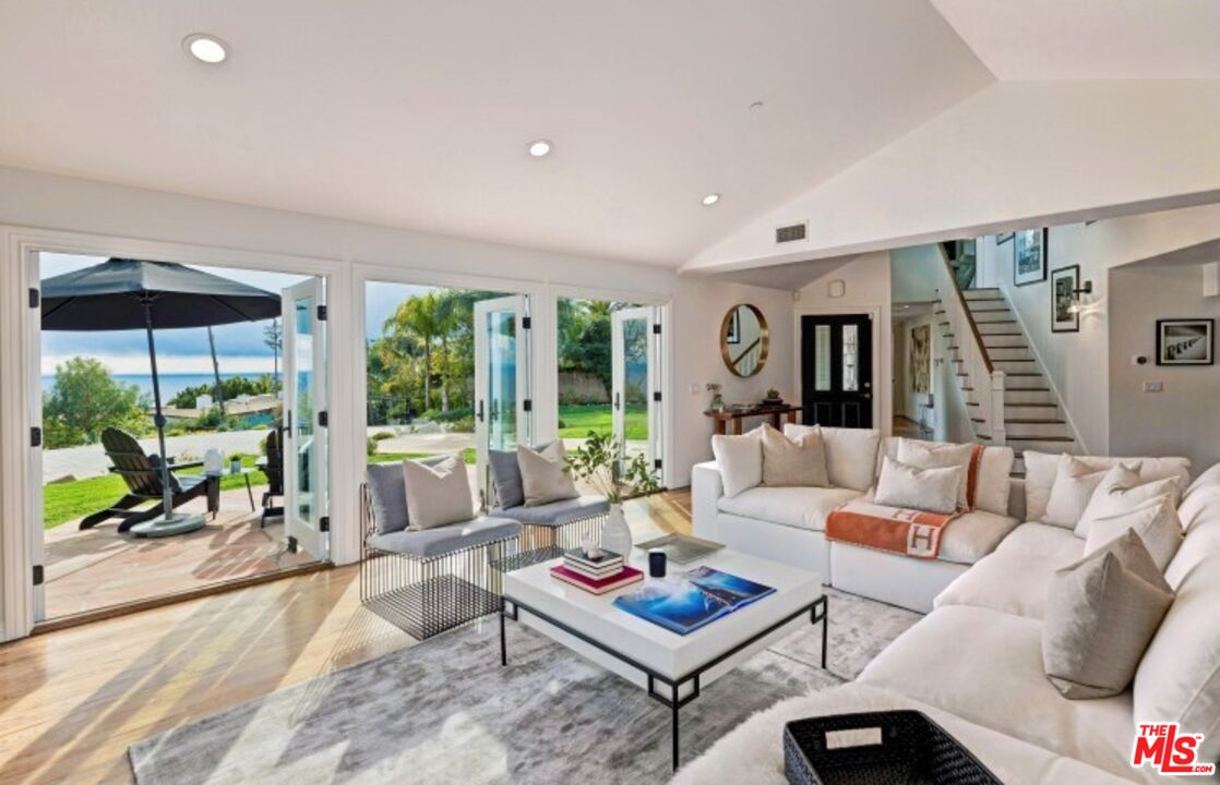 20779 Big Rock Drive Malibu, CA 90265 - Photo 8 of 37 a living room with furniture and a large window