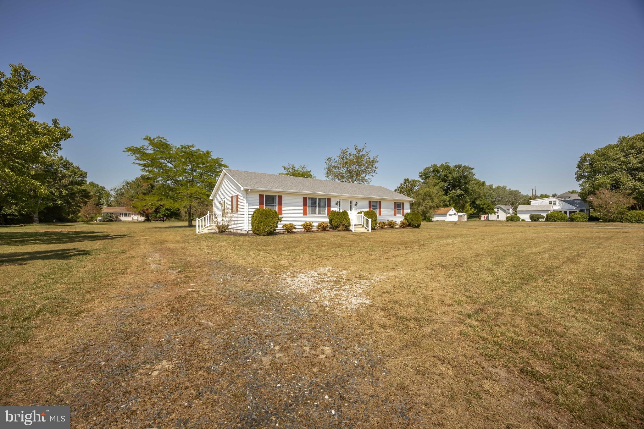 9830 Sharptown Road Mardela Springs, MD 21837 - Photo 49 of 51 a front view of a house with a yard