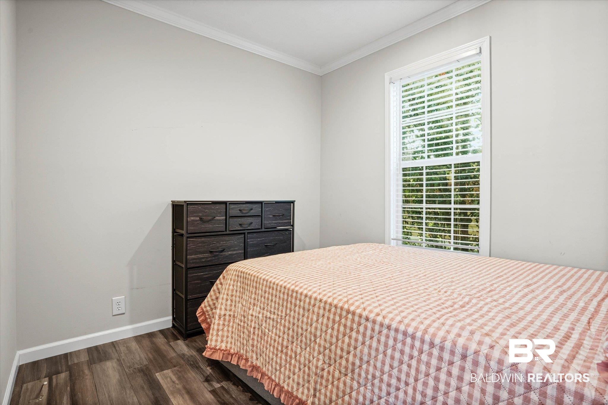 1325 Ridgewood Drive Lillian, AL 36549 - Photo 12 of 32 Bedroom with crown molding and dark wood finished floors