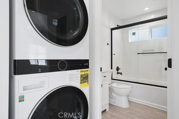 a bathroom with a toilet and a tub
