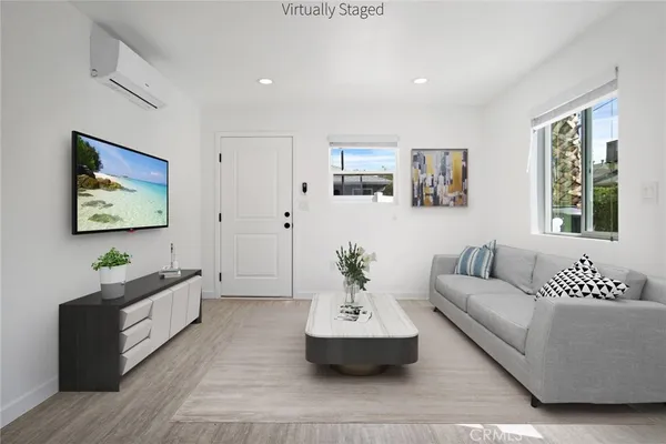 a living room with furniture and windows