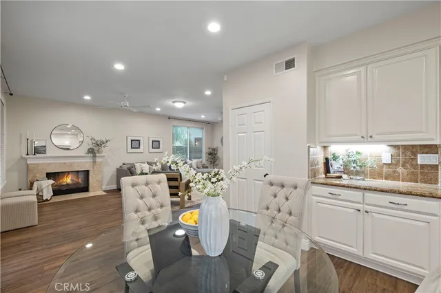 a living room with furniture fireplace and a view of living room
