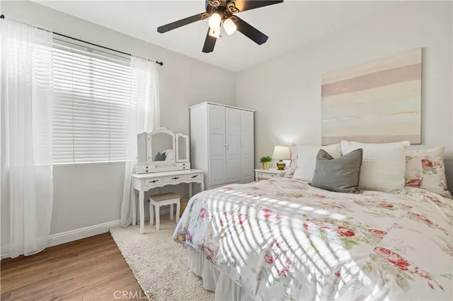 a bedroom with a bed and a desk