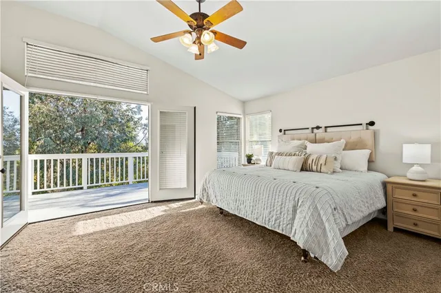 a bed room with a bed and a chandelier