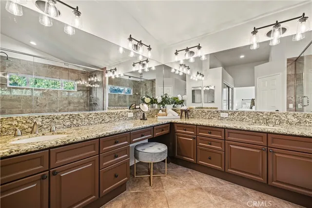 a large kitchen with kitchen island granite countertop a large island in the center and stainless steel appliances