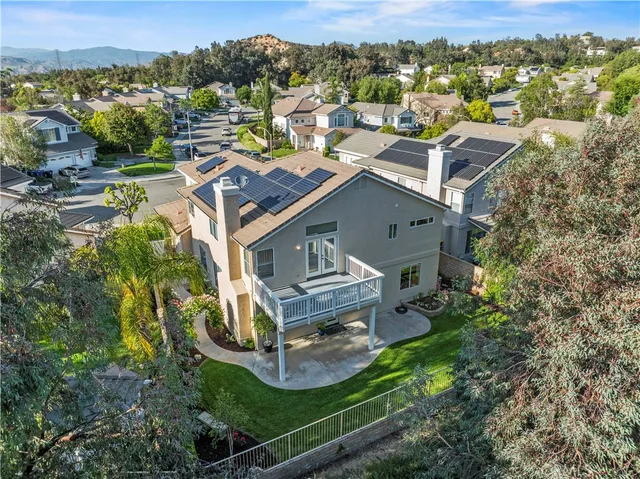 an aerial view of a house with a garden