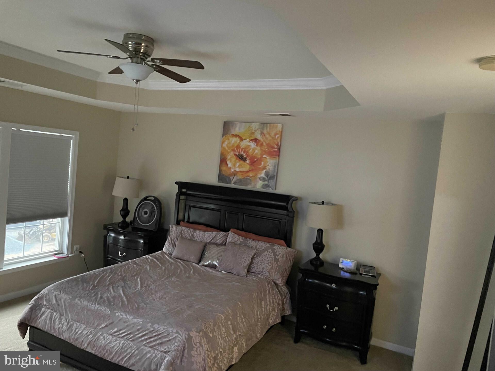 17696 Possum Point Road Dumfries, VA 22026 - Photo 11 of 45 a bedroom with a bed and a window